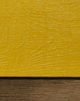 Historic house paint in bright yellow. Painted on wood. Linseed based paint.