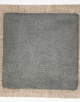 Gray linseed oil paint sample swatch on linen square.