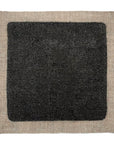 Deep black linseed oil paint sample on square of linen. Solvent-free paint. Better paint for the planet.
