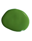 Round wet paint sample of Chrome Oxide Green linseed oil paint.