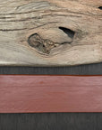Iron oxide red linseed paint on rough sawn timber. Historic colors from old fashioned paint formulas.