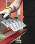 Speedheater Rapid Slim being used on a window in order to quickly and effectively strip old paint off of the wood.