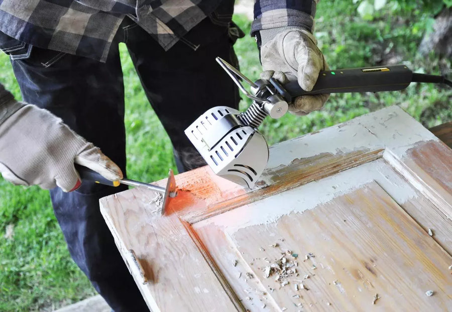 A Speedheater board scraper removing paint from a door with the use of a Speedheater Cobra.